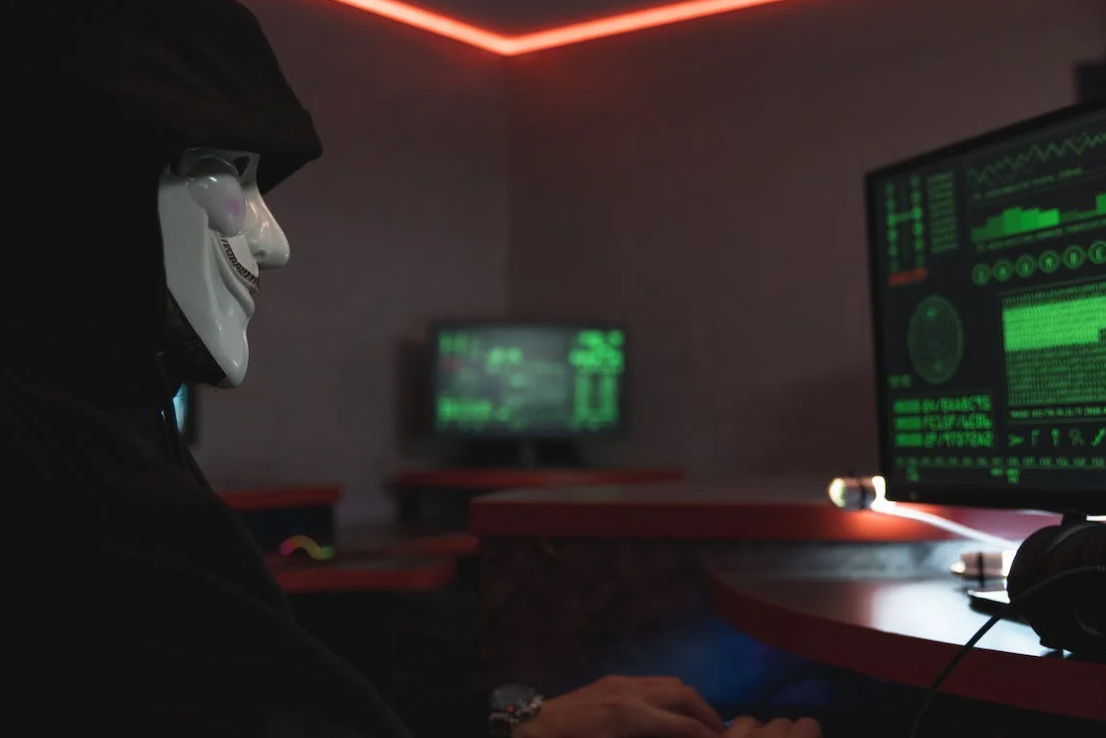 A hacker sitting in front of a screen