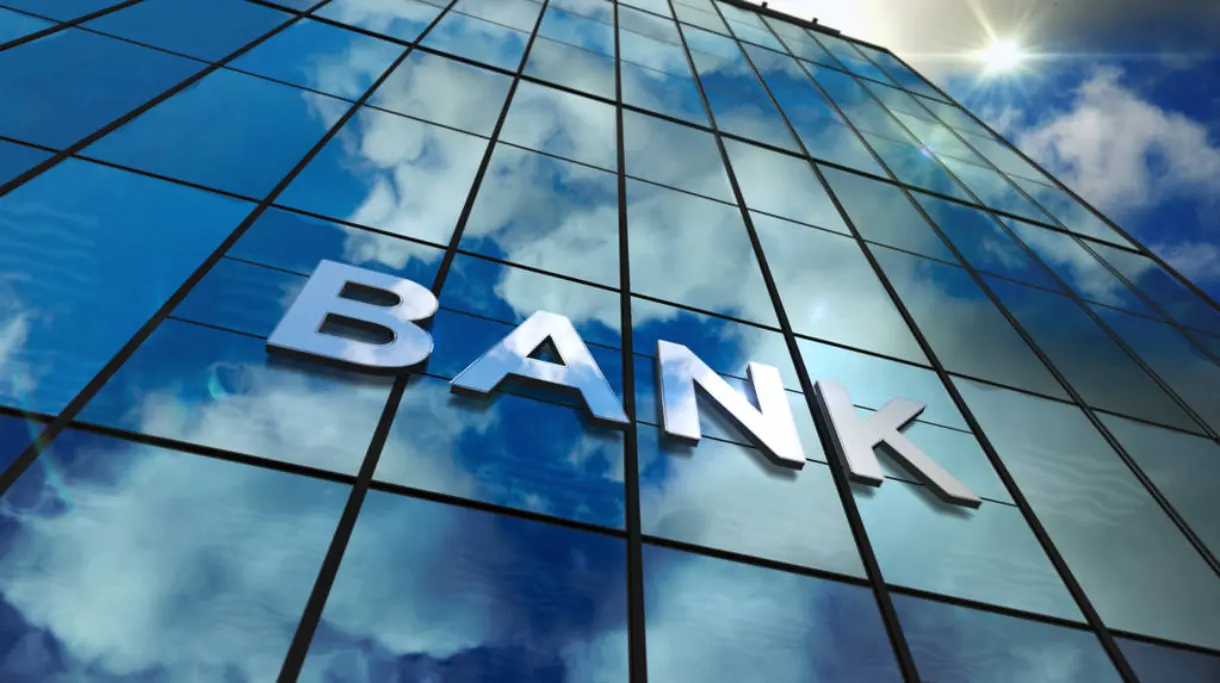 A huge banking logo on the banking building.